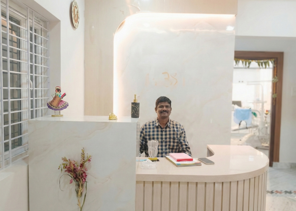 Dr. Shirish at the reception desk of Ekadantam Dental Clinic